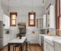 A light-touch approach was made in the kitchen, by painting the walls and cabinetry in “Decorators White” by Benjamin Moore A light-touch approach was made in the kitchen, by painting the walls and cabinetry in “Decorators White” by Benjamin Moore