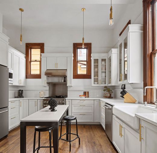 A light-touch approach was made in the kitchen, by painting the walls and cabinetry in “Decorators White” by Benjamin Moore A light-touch approach was made in the kitchen, by painting the walls and cabinetry in “Decorators White” by Benjamin Moore