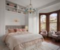 Hill designed a built-in bed nook that includes shelving, and his and her closets on either side Hill designed a built-in bed nook that includes shelving, and his and her closets on either side