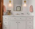 The primary bath includes a gorgeous custom vanity with marble top and marble and brass decorative flooring The primary bath includes a gorgeous custom vanity with marble top and marble and brass decorative flooring