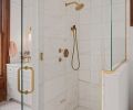 An enlarged shower features Ann Sacks tile and Watermark plumbing fixtures An enlarged shower features Ann Sacks tile and Watermark plumbing fixtures