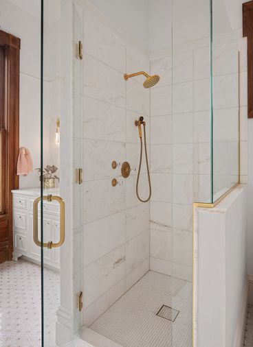 An enlarged shower features Ann Sacks tile and Watermark plumbing fixtures An enlarged shower features Ann Sacks tile and Watermark plumbing fixtures