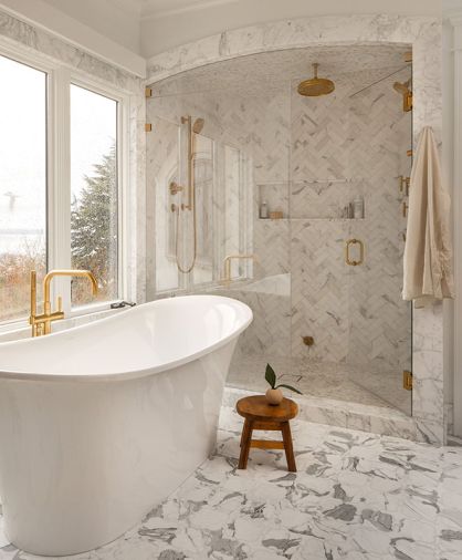 A Victoria & Albert tub from Ferguson, paired with Calacatta Gold marble and zellige tile, steals the show in the primary bath A Victoria & Albert tub from Ferguson, paired with Calacatta Gold marble and zellige tile, steals the show in the primary bath