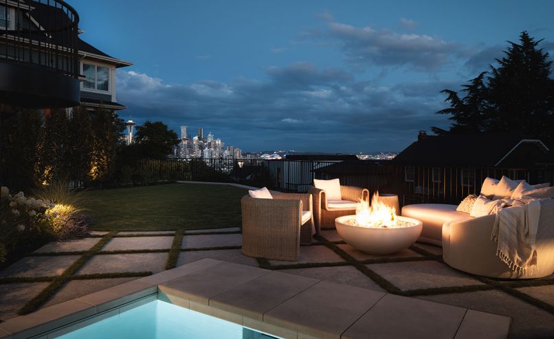 The inspiration for this project was to maximize available space—both inside the home and within the backyard. Because this home is situated on a small lot, an excavator had to be craned in over the fence from the street below. The intimate poolside lounge area features Lumacast’s OVA slim fire feature and a sensational view of downtown Seattle The inspiration for this project was to maximize available space—both inside the home and within the backyard. Because this home is situated on a small lot, an excavator had to be craned in over the fence from the street below. The intimate poolside lounge area features Lumacast’s OVA slim fire feature and a sensational view of downtown Seattle