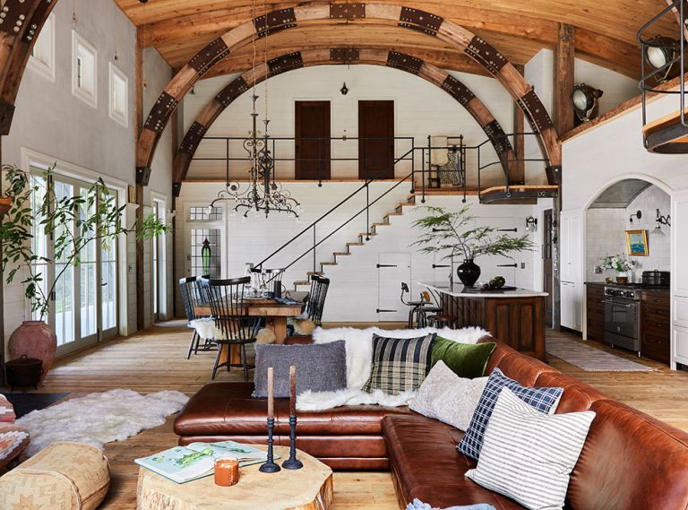 Anne designed the open plan’s large spaces with parties and festivities in mind. Stained glass windows enhance warm woods, white milk paint and tinted plaster walls. Anne designed the open plan’s large spaces with parties and festivities in mind. Stained glass windows enhance warm woods, white milk paint and tinted plaster walls.