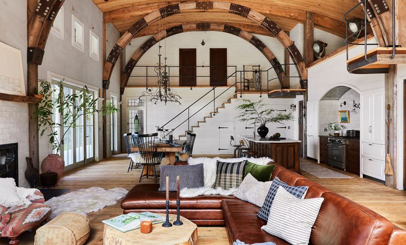 Anne designed the open plan’s large spaces with parties and festivities in mind. Stained glass windows enhance warm woods, white milk paint and tinted plaster walls. Anne designed the open plan’s large spaces with parties and festivities in mind. Stained glass windows enhance warm woods, white milk paint and tinted plaster walls.