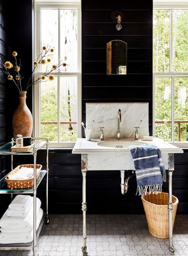 While strolling through Rejuvenation after coffee, Anne spotted the vintage marble sink that adorns the guest bath.The De Wolfs ferried the milled paneling from their property to and from Portland and stained it with General Finishes’ “Lamp Black”. While strolling through Rejuvenation after coffee, Anne spotted the vintage marble sink that adorns the guest bath.The De Wolfs ferried the milled paneling from their property to and from Portland and stained it with General Finishes’ “Lamp Black”.