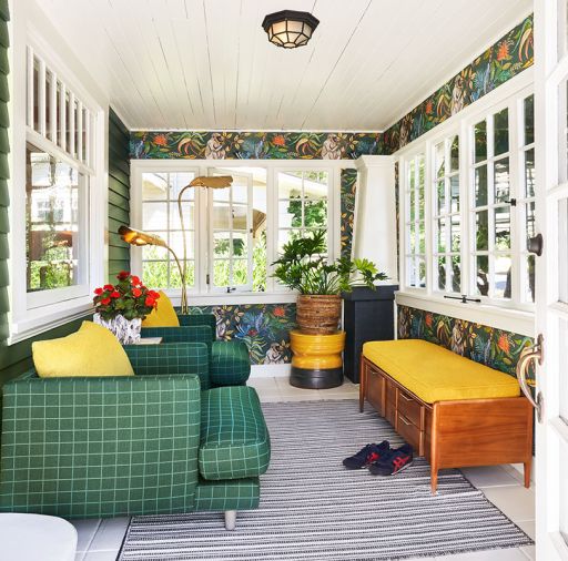 The sunroom with leafy green and golden rod colors accentuate its proximity to the lush garden. Monkeys happily populate the Savuti wallpaper; and the comfy Bernhardt chairs and Anthropology bench are in outdoor fabrics. The Rimini floor lamp illuminates via motion sensitive lighting. The sunroom with leafy green and golden rod colors accentuate its proximity to the lush garden. Monkeys happily populate the Savuti wallpaper; and the comfy Bernhardt chairs and Anthropology bench are in outdoor fabrics. The Rimini floor lamp illuminates via motion sensitive lighting.