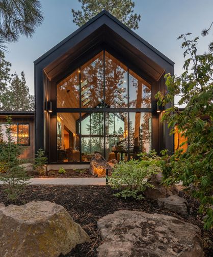 For the front facade, Island Sash & Door installed Weathershield windows and doors. The A-frame section, majestic in stature, is then wrapped in a metal roof and siding, adding weather protection from the harsh Central Oregon climate. For the front facade, Island Sash & Door installed Weathershield windows and doors. The A-frame section, majestic in stature, is then wrapped in a metal roof and siding, adding weather protection from the harsh Central Oregon climate.