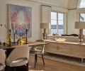 Marinello creates warmth, openness and sophisticated style in the décor by honoring the historical precedent found in classic furnishings by Gio Ponti and Saarinen and tying them to the homeowner’s collection of art, Sage Vaughan’s “Goners”. To help delineate the space, a custom credenza from Gauge Design Group was selected for added storage. Marinello creates warmth, openness and sophisticated style in the décor by honoring the historical precedent found in classic furnishings by Gio Ponti and Saarinen and tying them to the homeowner’s collection of art, Sage Vaughan’s “Goners”. To help delineate the space, a custom credenza from Gauge Design Group was selected for added storage.