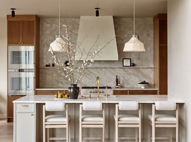 Anchored in natural materiality, the kitchen is awash in warm colors and organic textures. Custom cabinetry is plain-sawn white oak by Rockwood Cabinetry. Maiden Home counter stools and Newport Brass plumbing fixtures add sophistication, texture and shine. Anchored in natural materiality, the kitchen is awash in warm colors and organic textures. Custom cabinetry is plain-sawn white oak by Rockwood Cabinetry. Maiden Home counter stools and Newport Brass plumbing fixtures add sophistication, texture and shine.